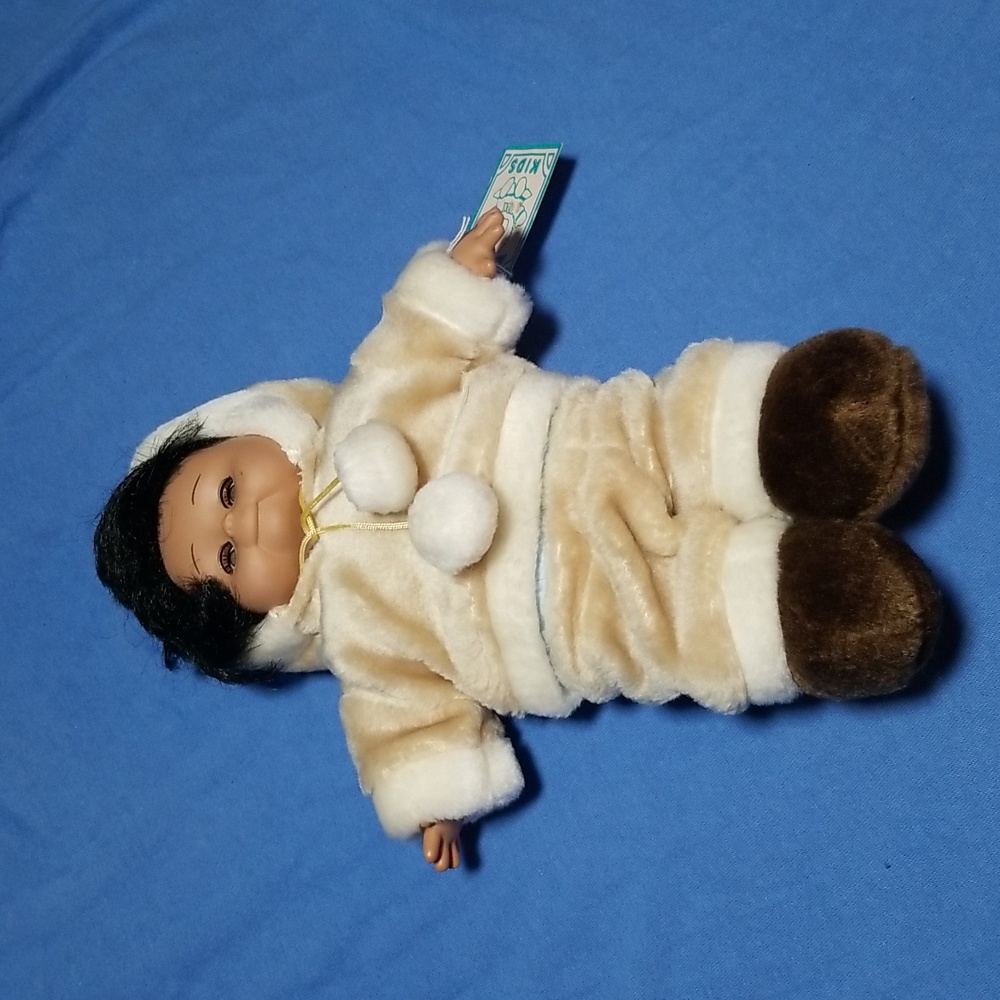 Eskimo Doll with blinking eyes.  BRAND NEW with tag